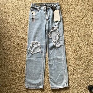 Woman’s ripped boyfriend jeans